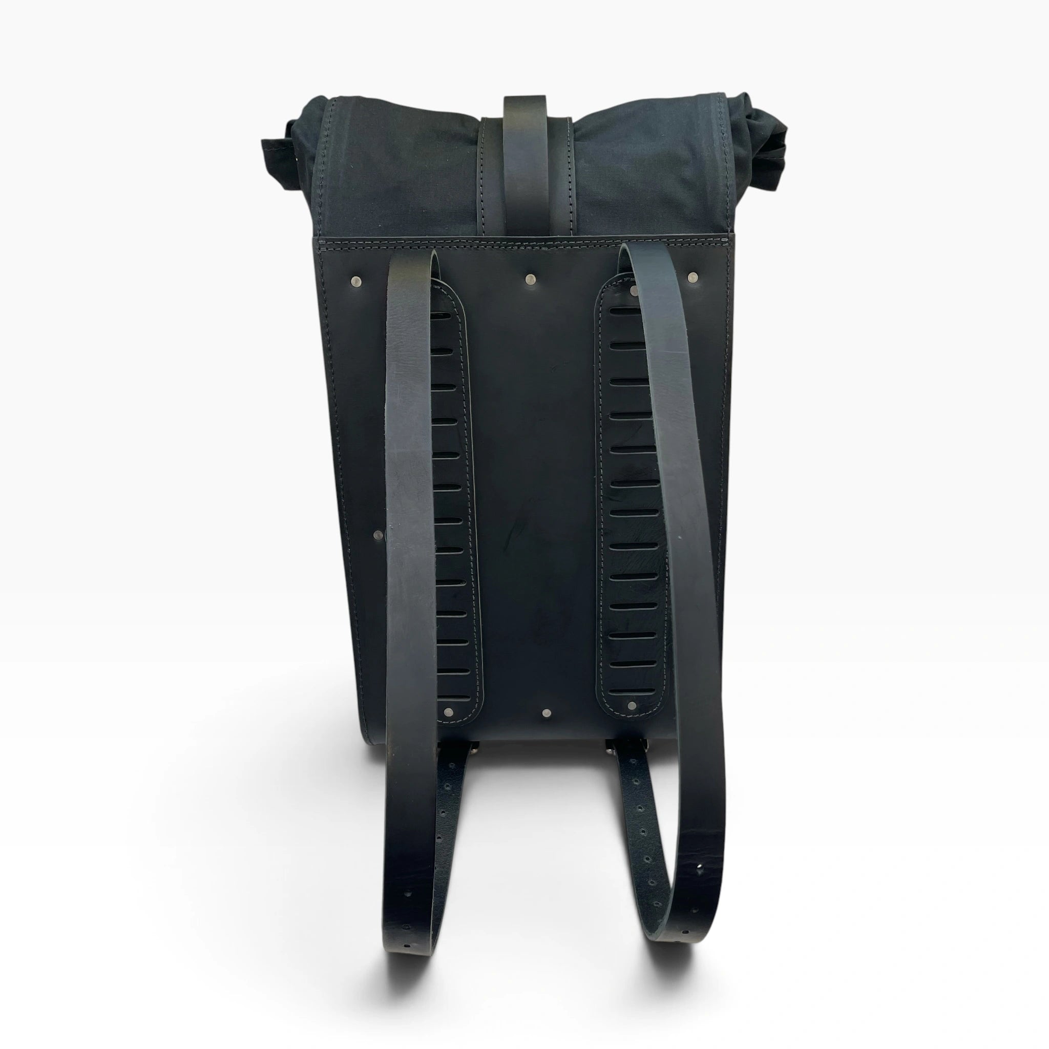 The back view of a black leather backpack with dual vertical padded shoulder straps and a top carry handle, shown on a clean white background.